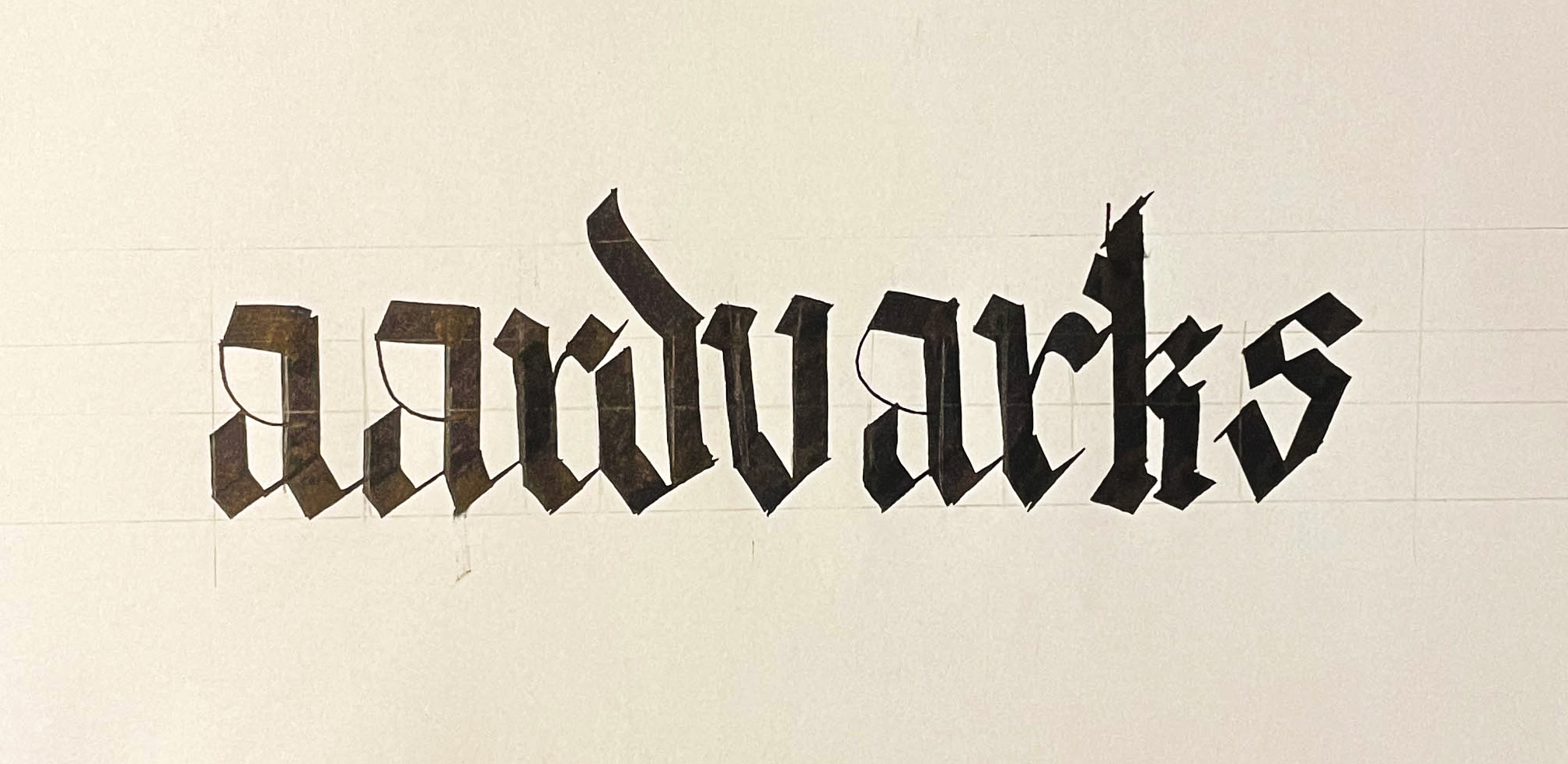 traditional calligraphy with sharp angular forms and historic elegance